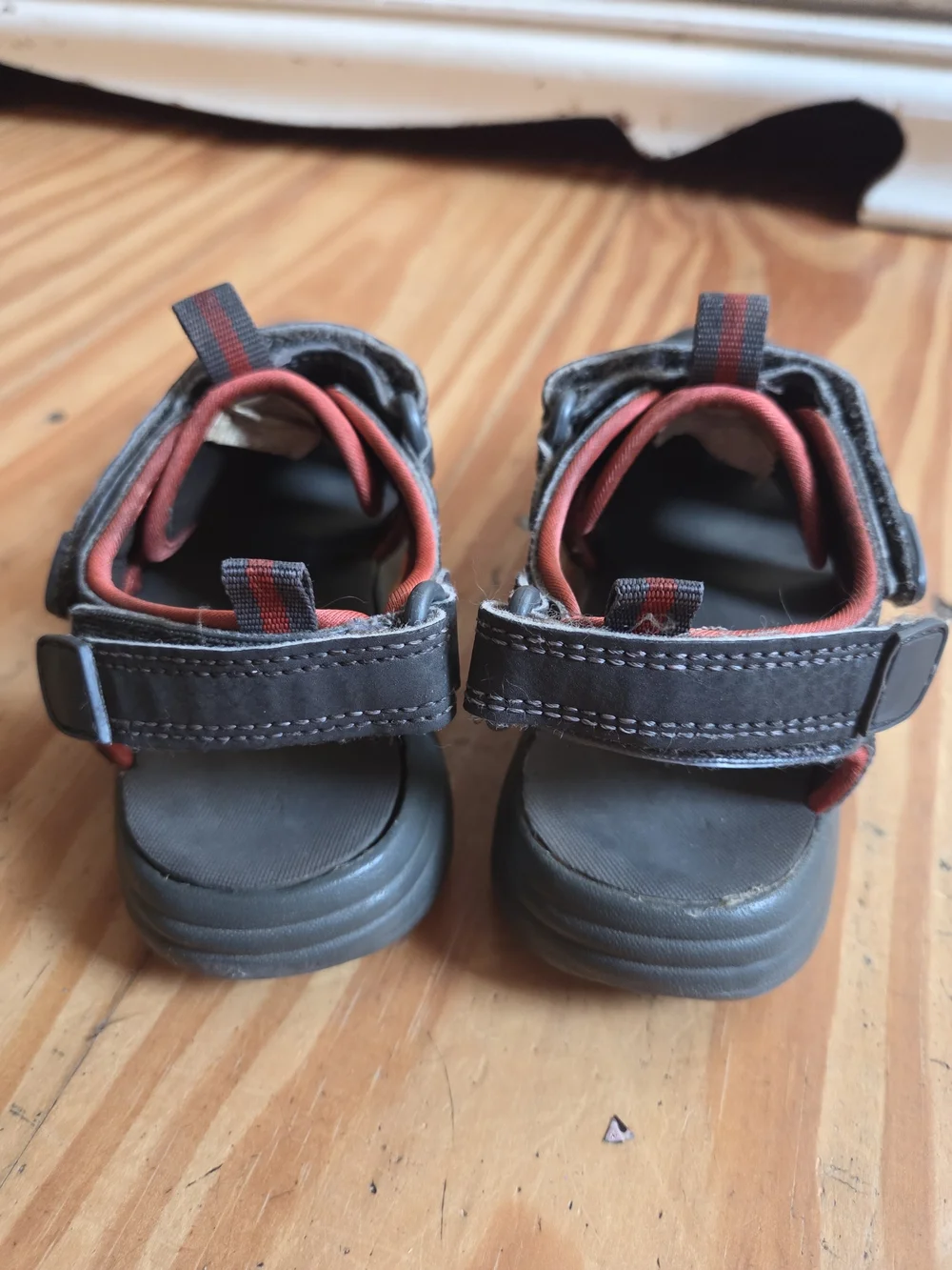 Kids Closed-Toe Sandals in Black with Orange Accents